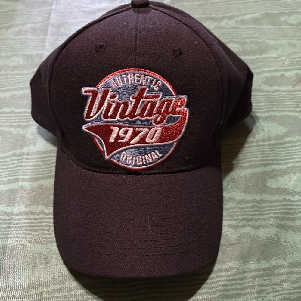Vintage black mens cap with an adjustable velcro strap. Never worn.
